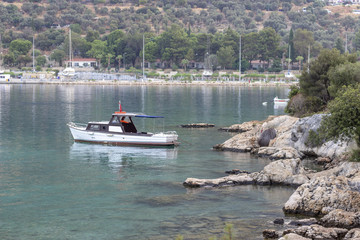 Obraz premium Perspective shoot of fishing boat on the small harbor of Mediterranean sea in Turkey