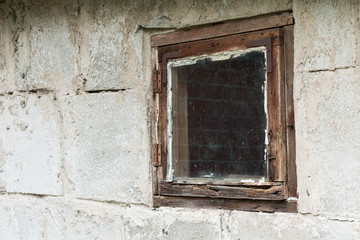 old rotten wood window in white wall