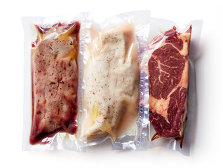 Meat vacuum sealed isolated on white background, from above