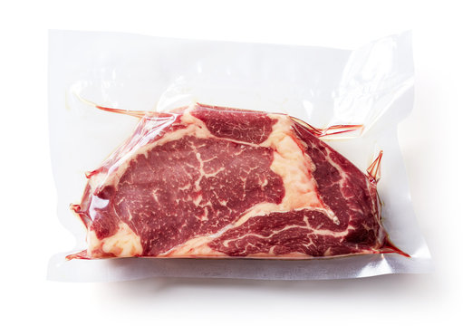 Beef steak vacuum sealed isolated on white, from above