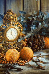 New Year's decor. Retro clock with old fashioned christmas tree decorations.