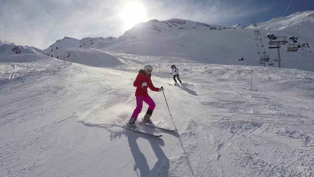 Skier Skiing On A Mountain Slope Winter On A Ski Spraying Snow Powder