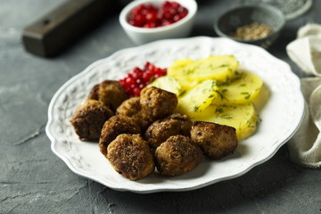 Meatballs with potato and red berries