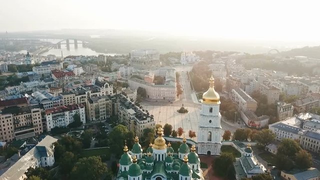 Saint Sophia's Cathedral, square. Kiev (Kiyv) Ukraine with Places of Interest. Aerial drone video footage. Sunrise light. City panarama. Summer time. Dnipro river and bridge. City center