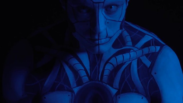 Turn on a futuristic male android, an evil robot