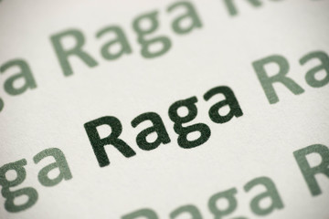 word Raga language printed on paper macro