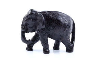 Black elephant like wooden carving with white ivory. Stand on white background, Isolated, Art Model Thai Crafts, For decoration Like in the spa.