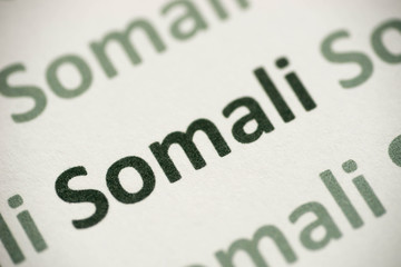 word Somali language printed on paper macro