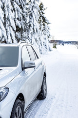 Car in snow-covered winter scenery