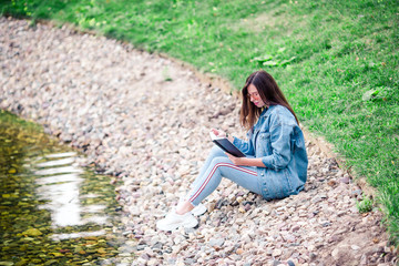 Relaxed young woman reading book