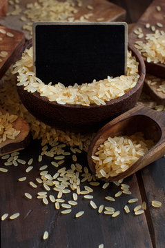 Parboiled rice with a wooden spoon