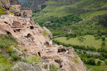 Fototapeta na wymiar many cave-cells in the mountain. Vardzia Monastery