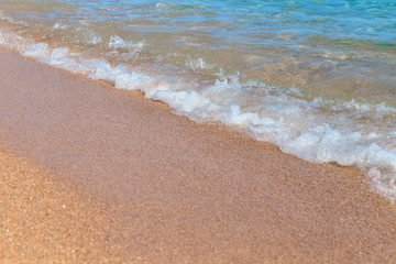 Sea wave, running on the sandy shore