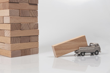 Wooden Block Carrying Car on a White Background