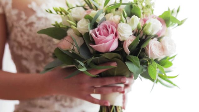 Young Beautiful Bride In White Luxury Dress Is Holding Bright Bouquet Of Pink Flowers. Concept Of The Wedding Ceremony