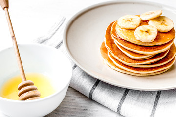 cooked pancake on plate at wooden background