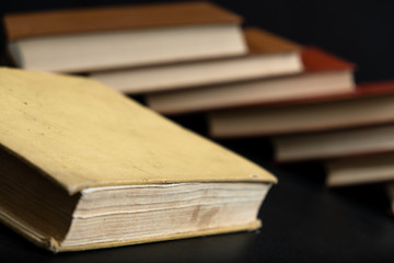 Old book on wooden background.