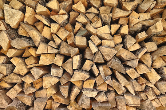 Firewood background. Preparation of firewood for the winter