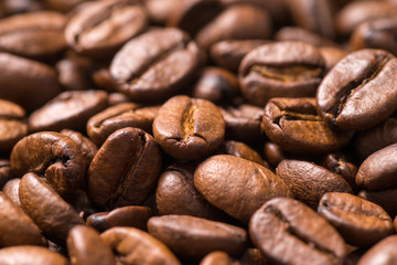 Roasted coffee beans close up, full frame background