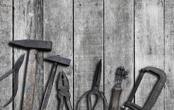 Old tools on wood background with copy space