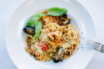 Italian food - spaghetti pasta with seafood - mussels and shrimps.