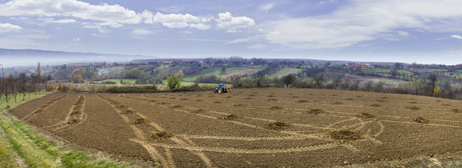 Naklejka premium Drilling Holes with Tractor