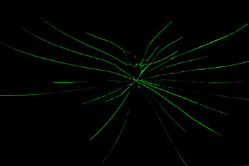 Obraz premium cracks on the glass on a black background