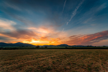 Obraz na płótnie Canvas sunset on the field in alsace