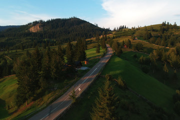 Fototapeta premium Aerial landscape of the mountain road, at sunrise