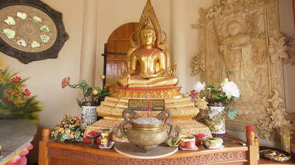 Obraz premium Statue of the Buddha god, Sacrifice oblation, traditional offerings for Gods in the Buddhist temple Brahma Vihara Indonesia. Bali Architecture, Ancient design. Travel concept.