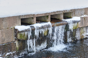 Icicles on canal in Catherine park at Tsarskoe Selo in winter. Pushkin. Saint Petersburg. Russia