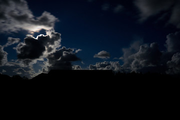illuminated clouds at full moon