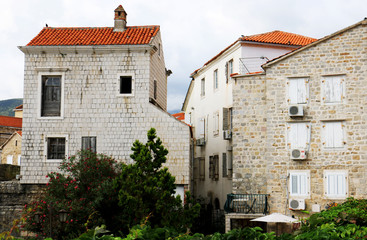 Fototapeta na wymiar Budva old town. Historic streets, old houses and St. John's Church square. Montenegro, 2018.