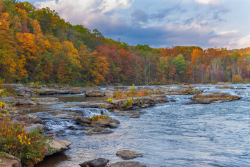 The Youghiogheny River as it flows through Ohiopyle State park in autumn near sunset