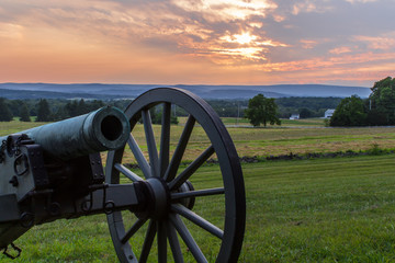 A cannon at Gettysburg, part of the National Park Service, at sunset - obrazy, fototapety, plakaty