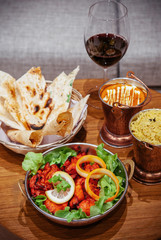 Chicken tandoori with tikka masala sauce, Papadum and Indian herbal rice