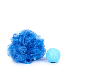 Blue bath sponge and aroma bomb isolated on white background, copy space template