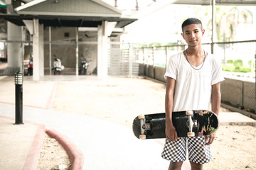 Handsome skateboarder portrait.