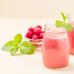 Raspberry smoothie close up photography with fresh summer blended cocktail and ripe berries.