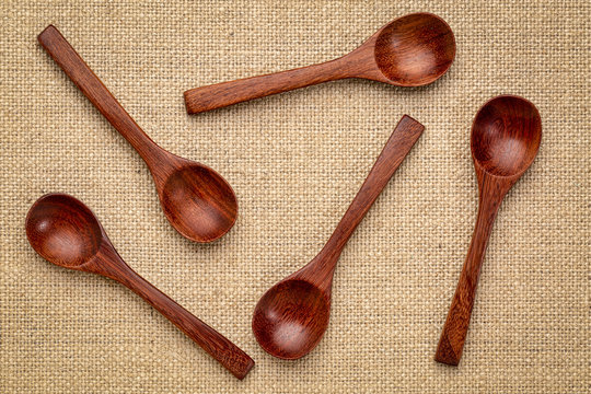 wooden teaspoons on burlap canvas