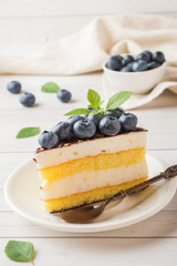 Cake of a souffle with glaze and fresh blueberries.