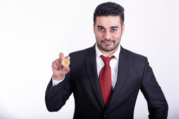 Businessman holding golden bitcoin isolated.