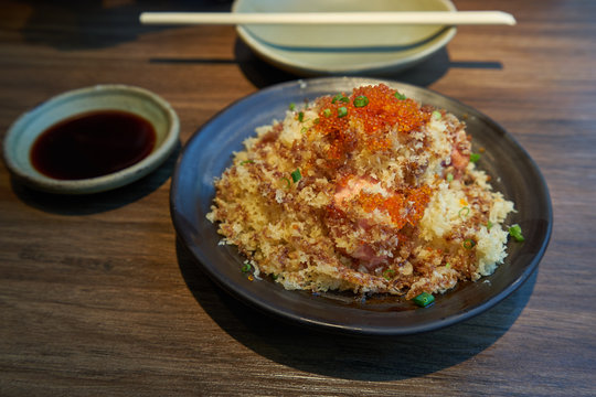 salmon crunchy crispy spicy source with ebi egg on top