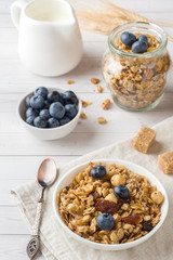Oat flakes, granules and nuts muesli with blueberries. The concept of healthy food, Breakfast.