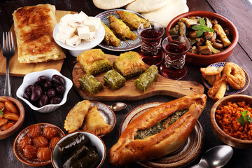 Middle eastern or arabic dishes and assorted meze, concrete rustic background. sambusak. Turkish...