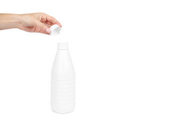 White plastic milk bottle with hand isolated on white background, copy space template