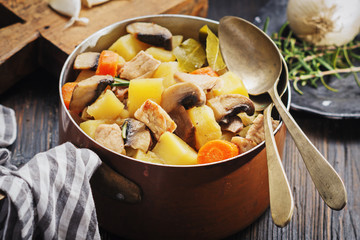 Mushroom stew on black rustic board