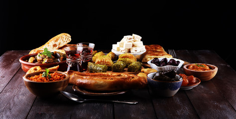 Middle eastern or arabic dishes and assorted meze, concrete rustic background. sambusak. Turkish...
