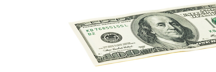 Part of the bill is a hundred dollars diagonally. View at an angle.