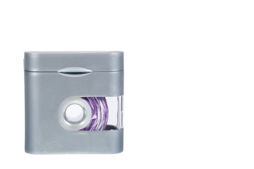 Dental floss in grey container isolated on white background, copy space template